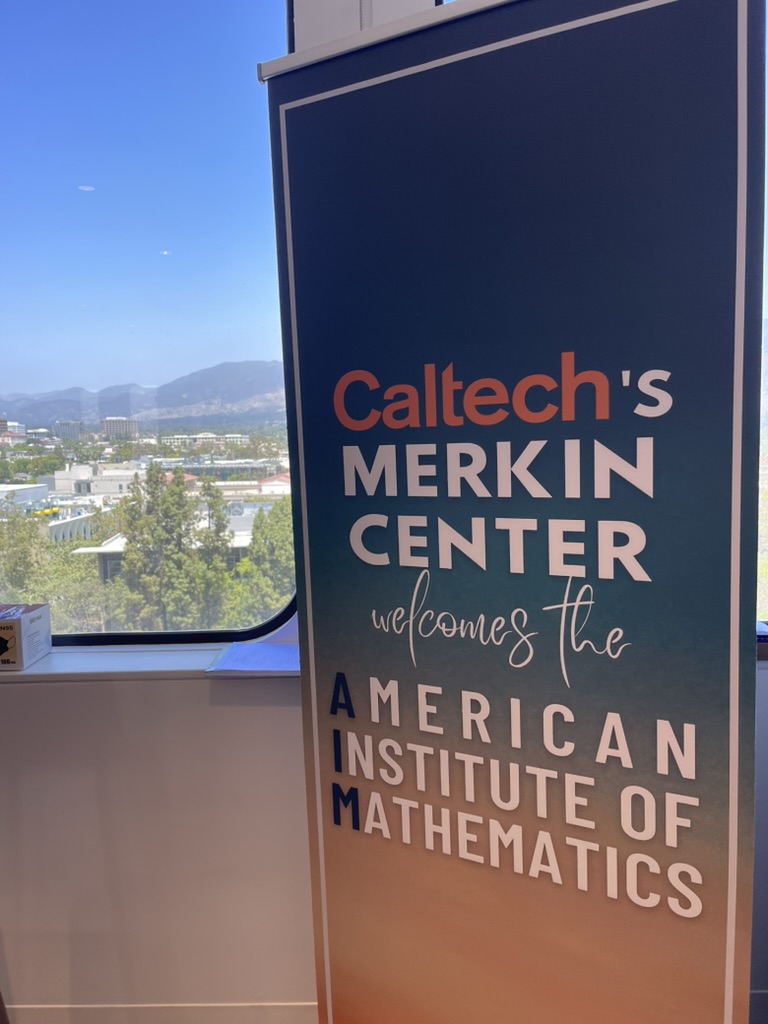 A banner reading Caltech's Merkin Center welcomes the American Institute of Mathematics.