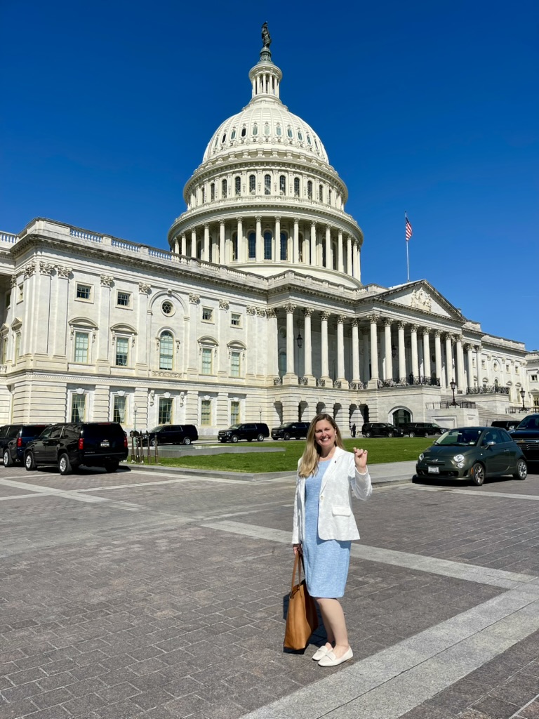 Ann standing in front of the U.S. Capitol building.