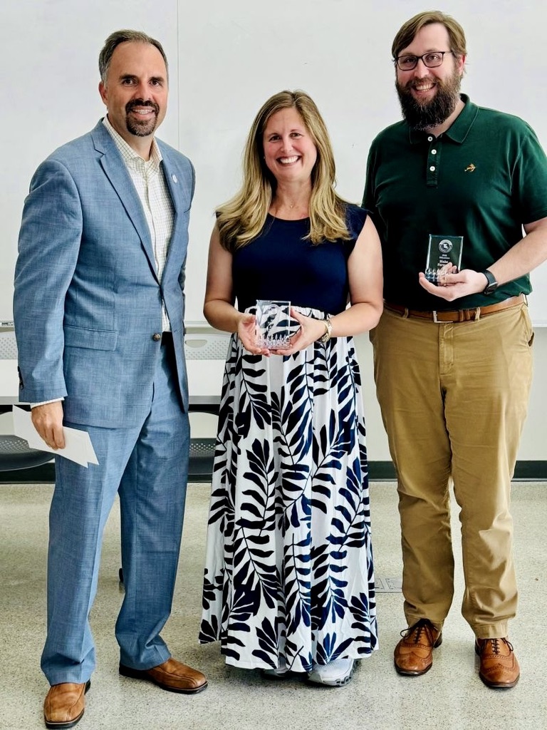 Ann and Dr. Blake Farman holding their 2025 COES Education Award trophies, standing with a college administrator.