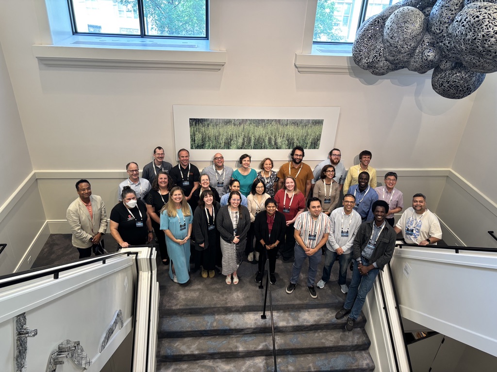 A large group of Engineering Unleashed workshop participants posing together on a staircase.